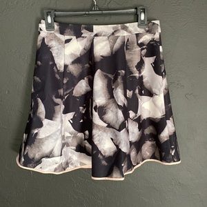 Mosso skirt, black background white silver tone flowers